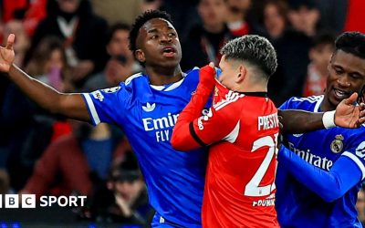 Real Madrid's Vinicius Junior reacts after an interaction with Benfica's Gianluca Prestianni