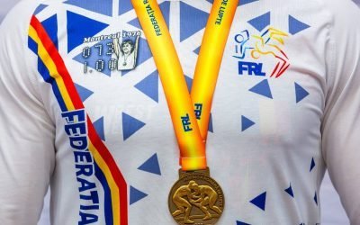 Nadia Comăneci, simbolul excelenței sportive, inspiră luptătorii români: imaginea gimnastei pe tricourile de campioni Federația Română de Lupte face un gest inedit pentru a celebra performanța Nadiei Comăneci, cea care acum 50 de ani obținea prima notă de zece din istoria Jocurilor Olimpice