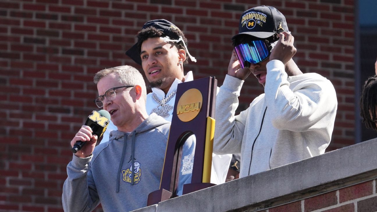 Michigan, May toast title with fans: 'This trophy is yours'